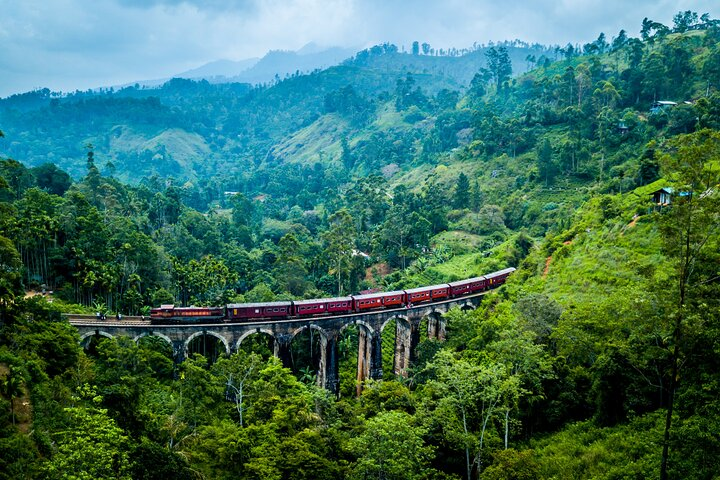 Nine arch Bridge with old classic red train